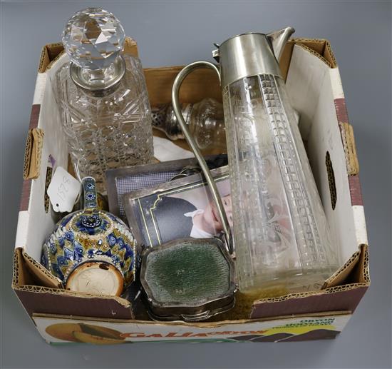 Three silver photograph frames, silver-mounted sugar caster, silver clothes brush and claret jug, Asprey decanter etc.